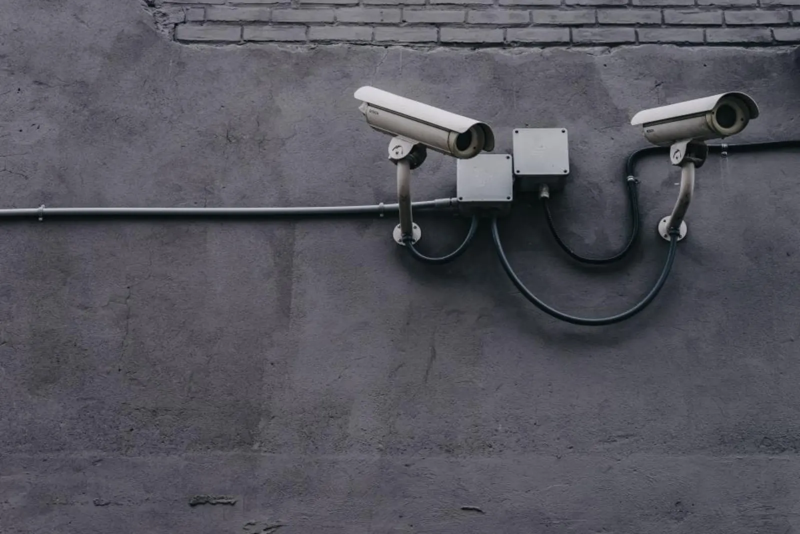Security cameras mounted on a commercial building wall